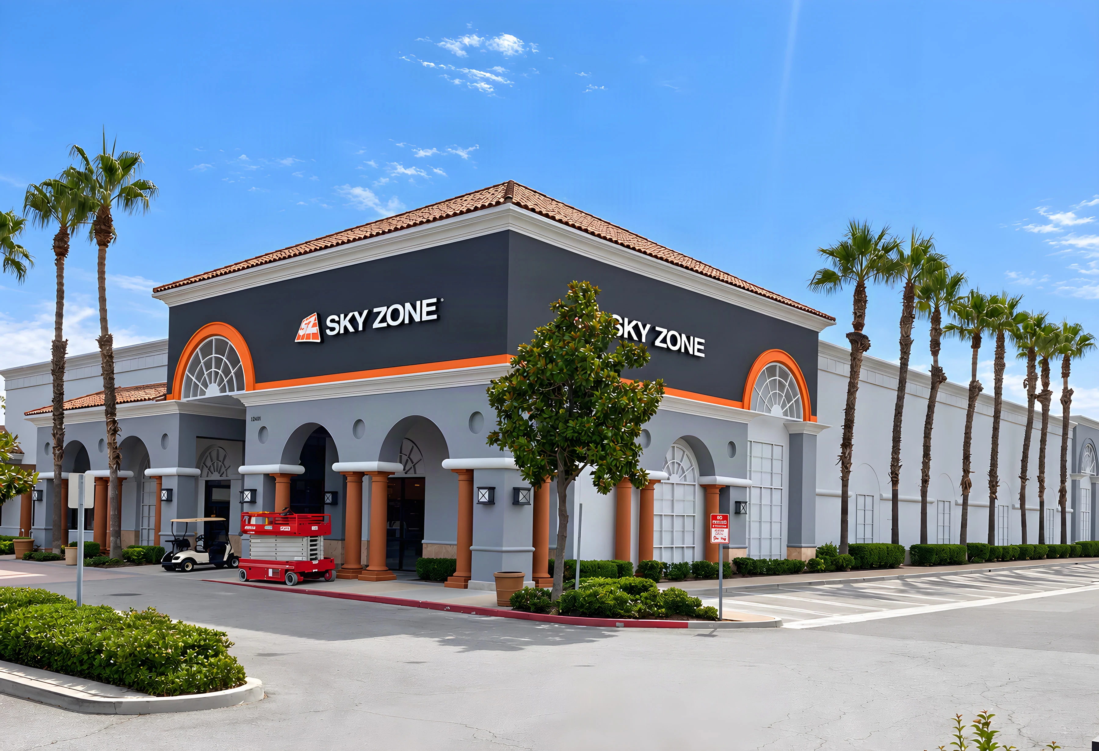 Sky Zone trampoline park exterior with arched Mediterranean-style facade and red tile roof