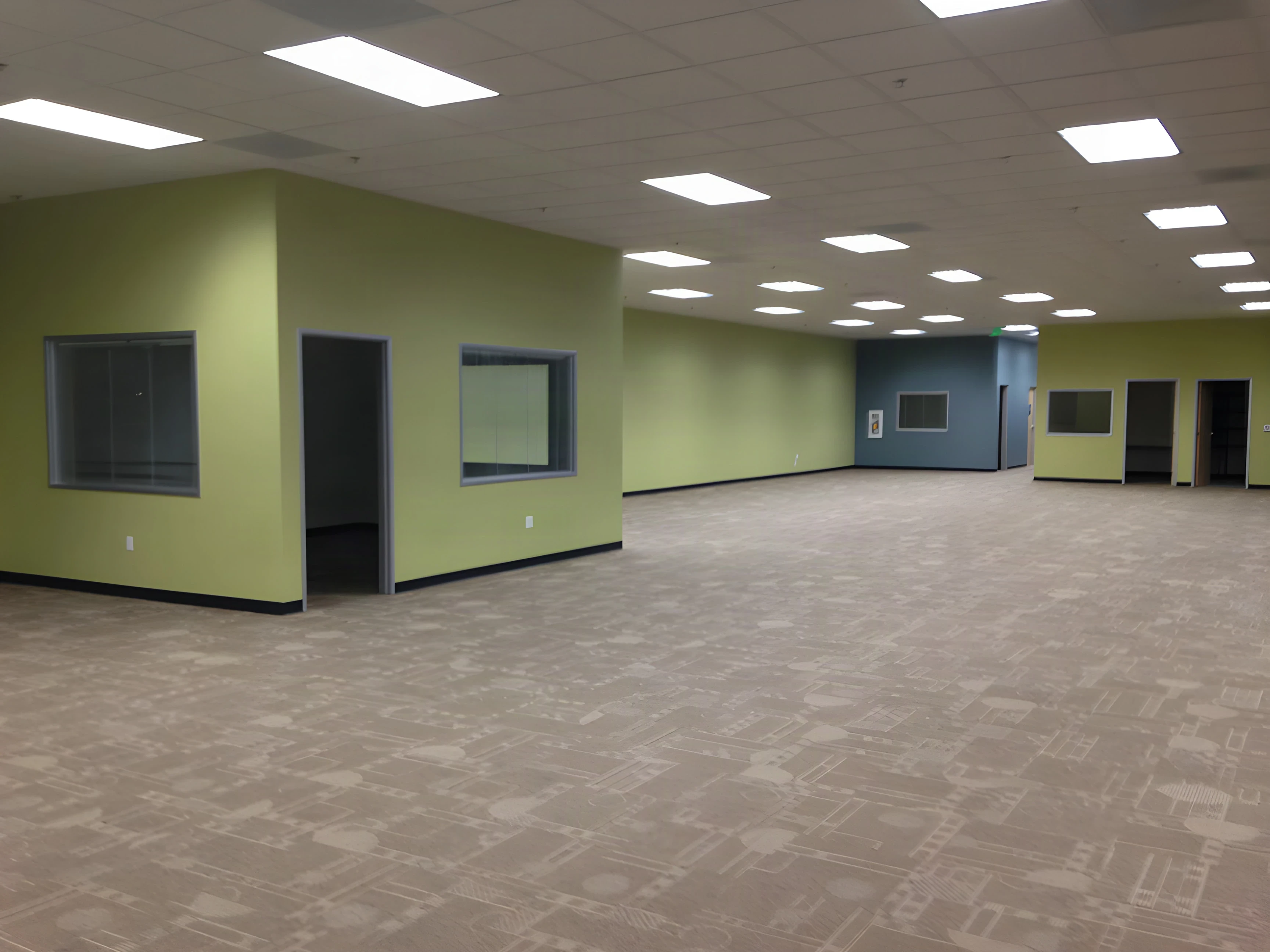 Large open floor with green office walls and patterned carpet at an Army career center