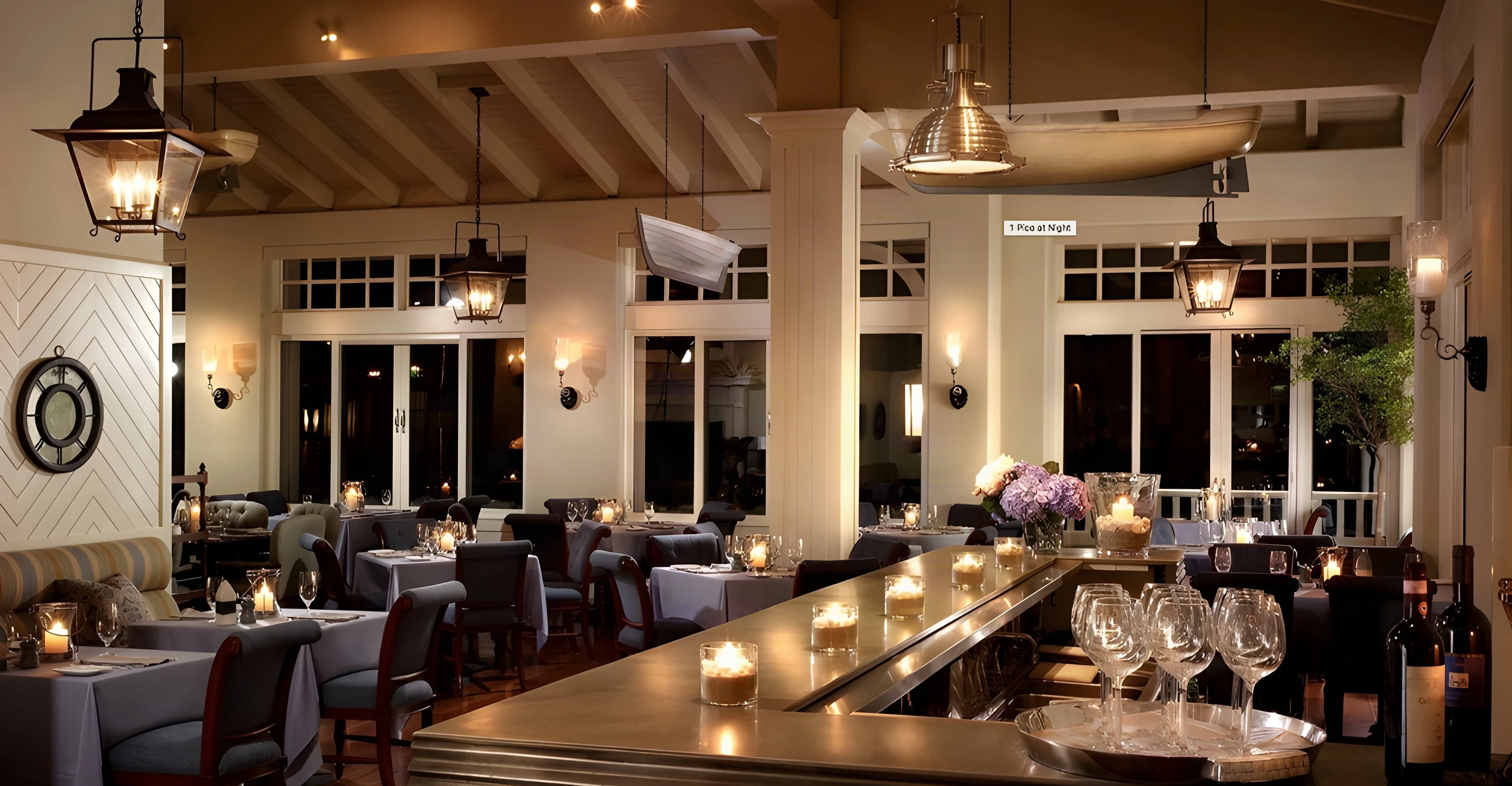 Candlelit restaurant bar and dining room at Shutters on the Beach in Santa Monica in the evening