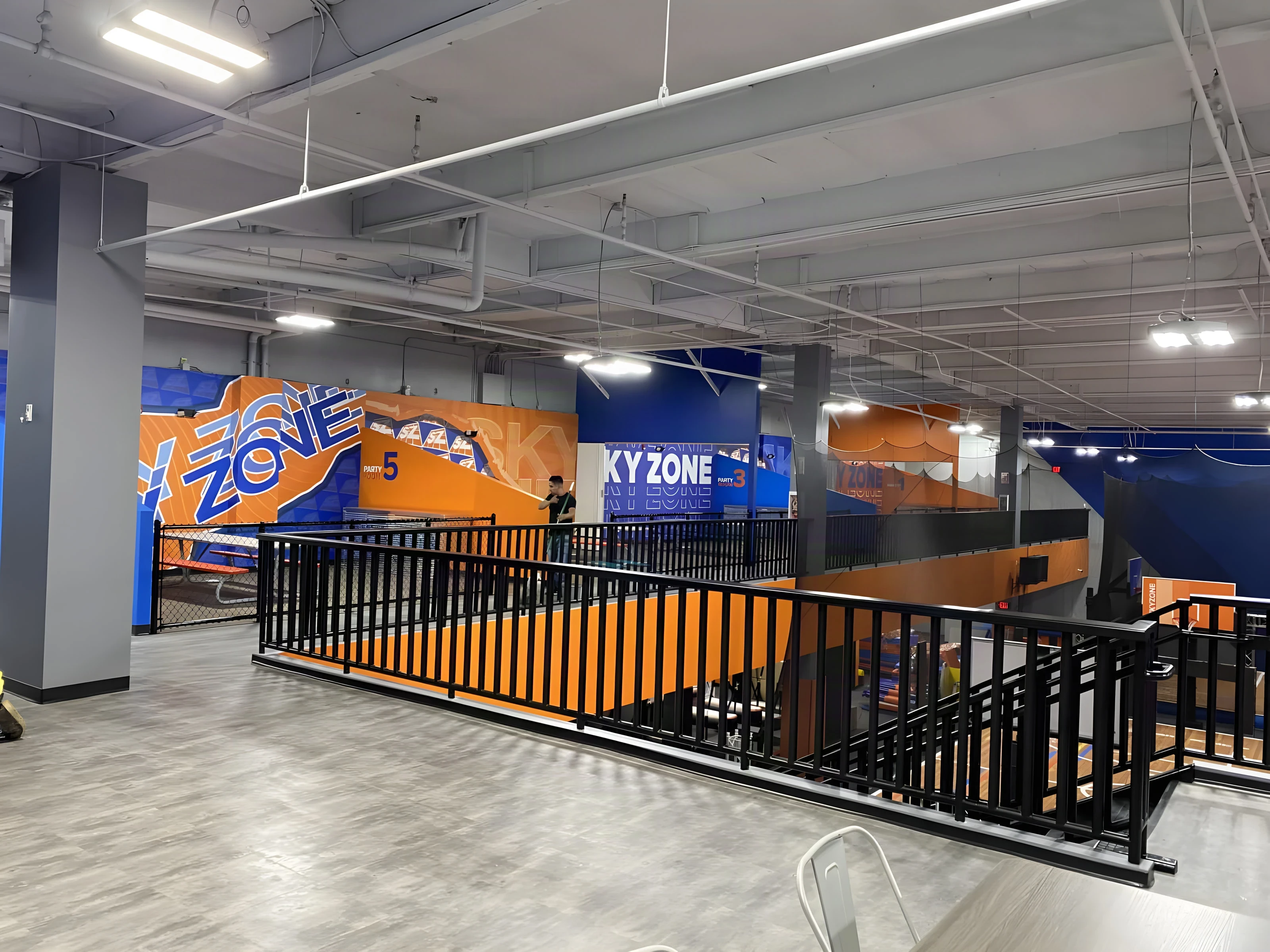 Railed upper walkway overlooking the park floor at Sky Zone Rancho Cucamonga